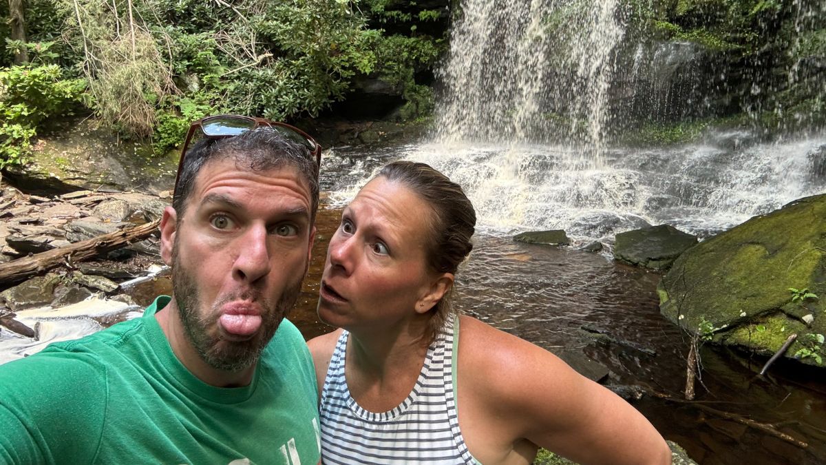 Darren Kanthal and Rachel Leigh in front of a waterfall in Bethel NY.