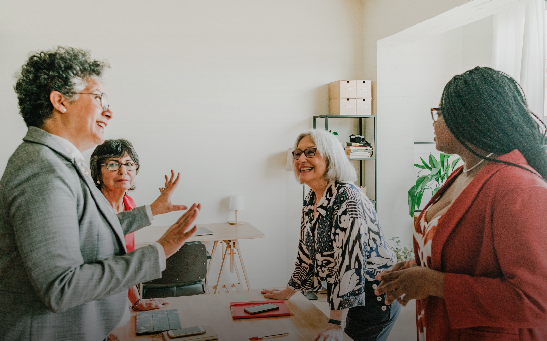A group of leadership executives are engaging in a lively conversation.